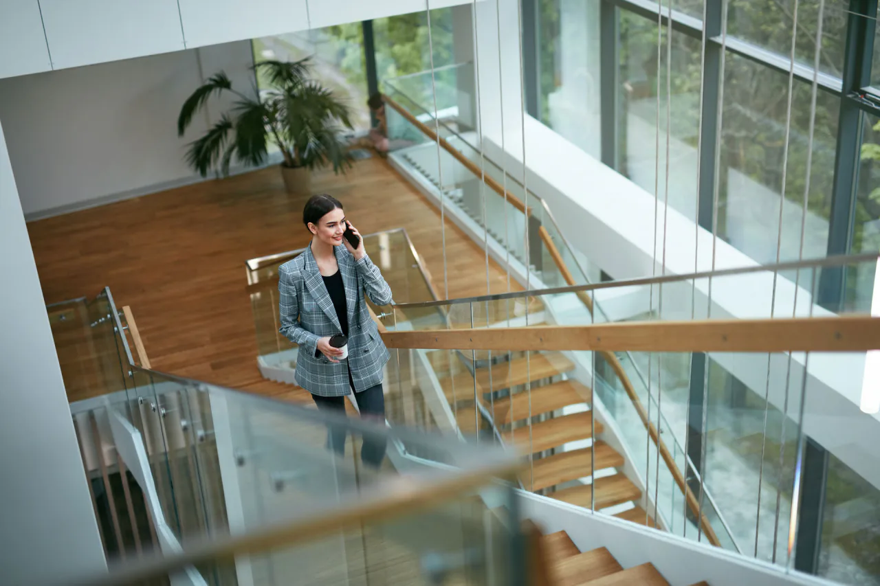 Office atrium with a glass staircase