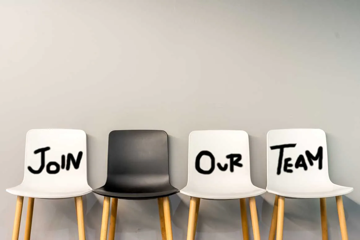 Four chairs spelling Join Our Team